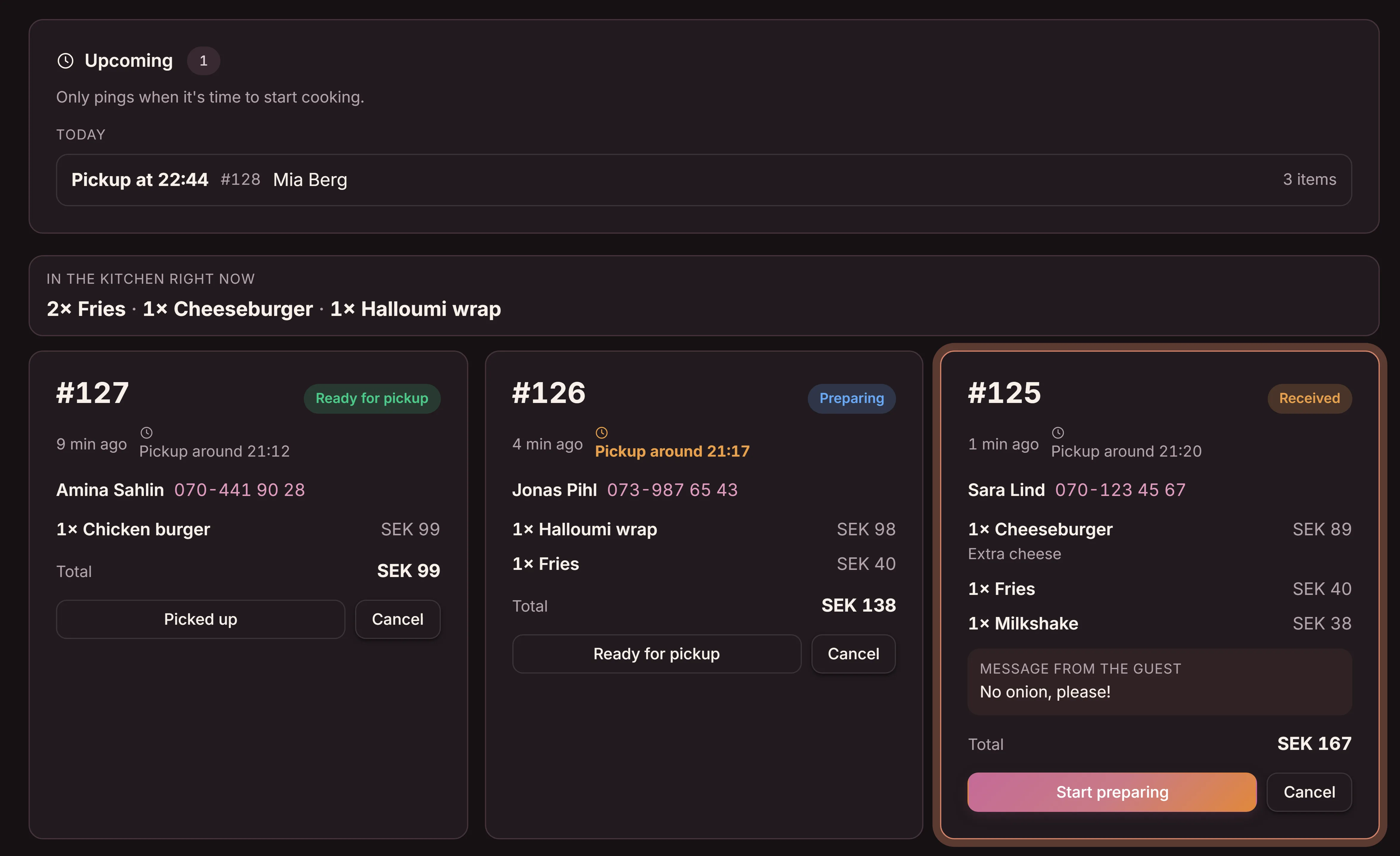 Orders in the Goboblo app at the fast food place Lantern Grill, in English: the line Right now in the kitchen showing 2× fries, 1× cheeseburger and 1× halloumi wrap, and three order cards in the states received, cooking and ready for pickup with the guest's name and total