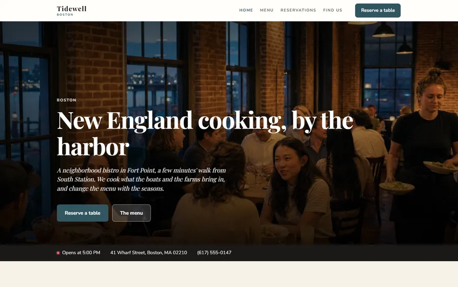 A finished restaurant website built in Goboblo: Tidewell in Boston, with a photo of the busy dining room by the harbor, the heading “New England cooking, by the harbor”, buttons to reserve a table and see the menu, and a bar with the opening time, address and phone number